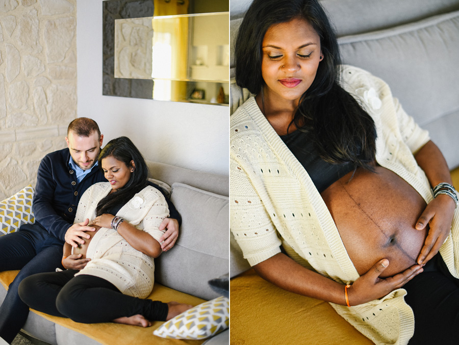 un homme regarde le ventre de sa femme enceinte